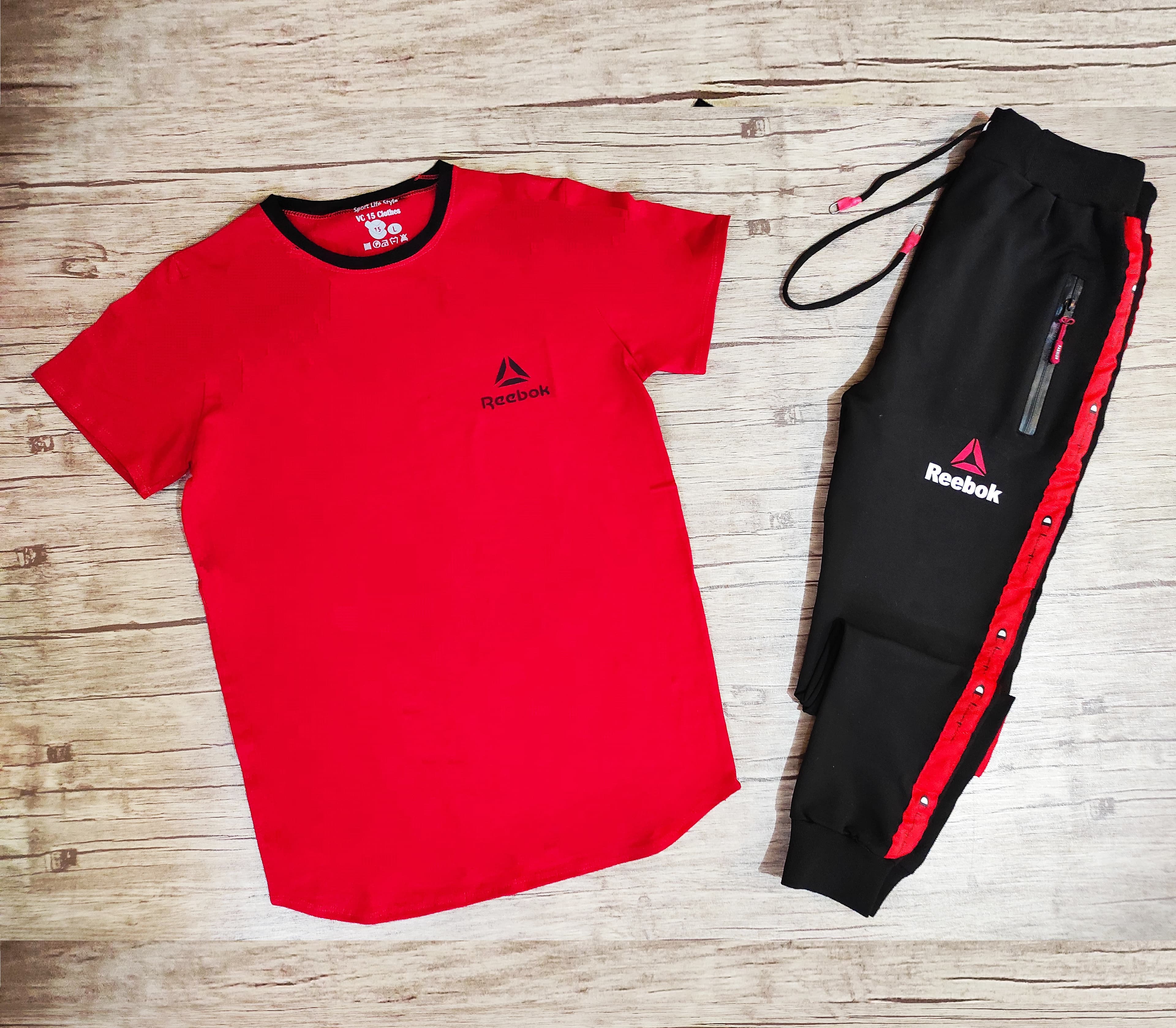ست تیشرت آستین کوتاه و شلوار REEBOK مثلث قرمز رنگ قرمز کد 174