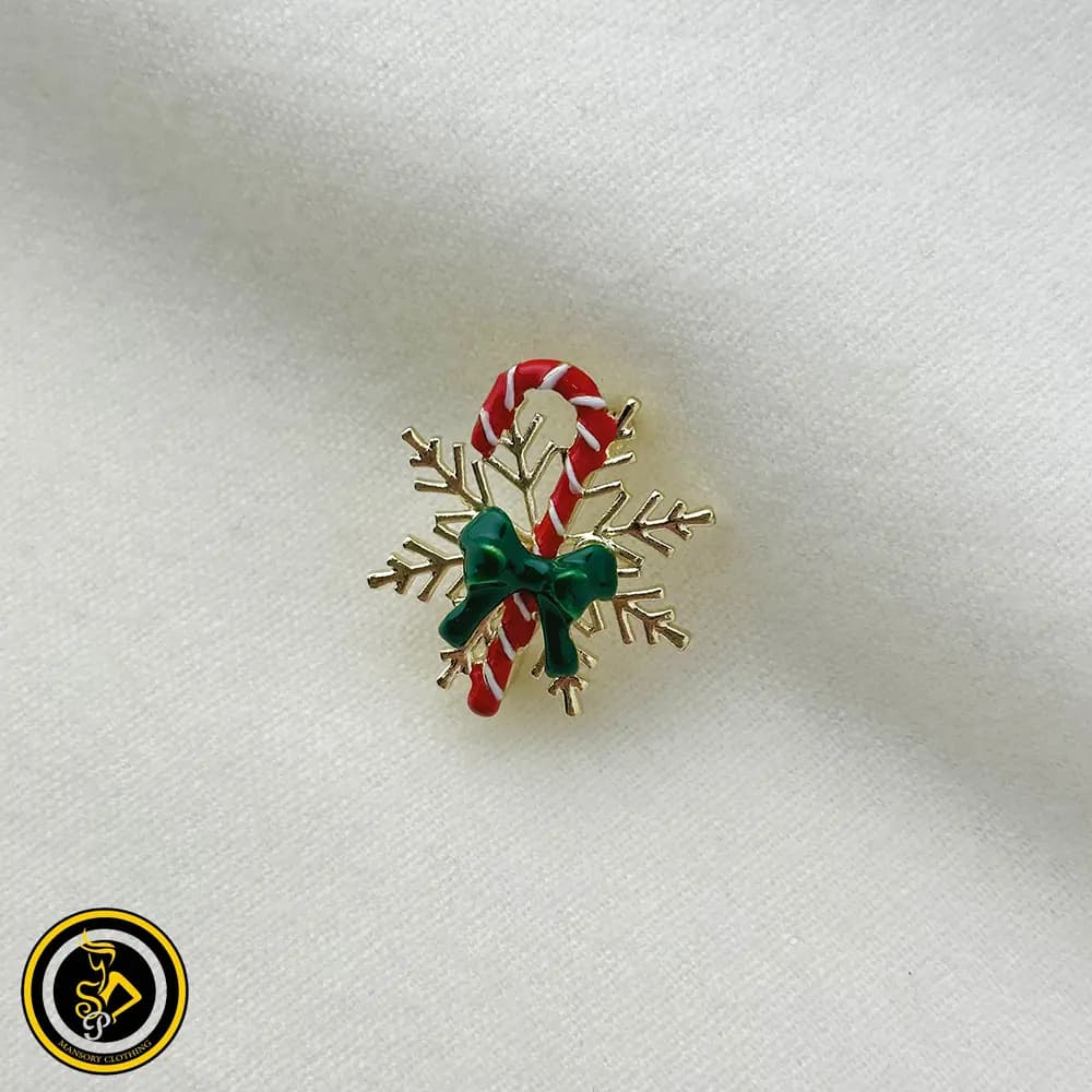 گل سینه طرح کريسمس دانه برف و عصا