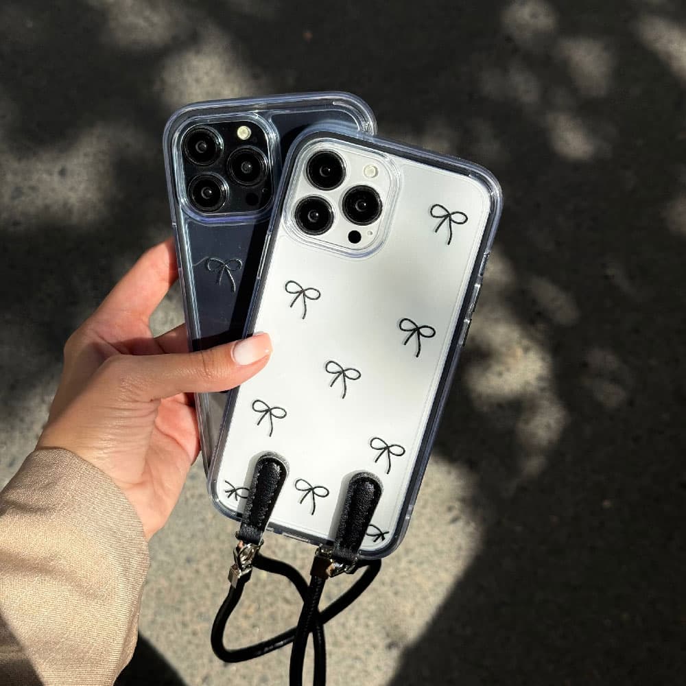 قاب پاپيونی مشكی شفاف به همراه اويز مناسب برای گوشی موبایل اپل آیفون Apple iPhone 13 / 13 Pro / 13 Pro Max / 14 / 14 Pro Max / 15 Pro Max / 16 / 16 Pro / 16 Pro Max