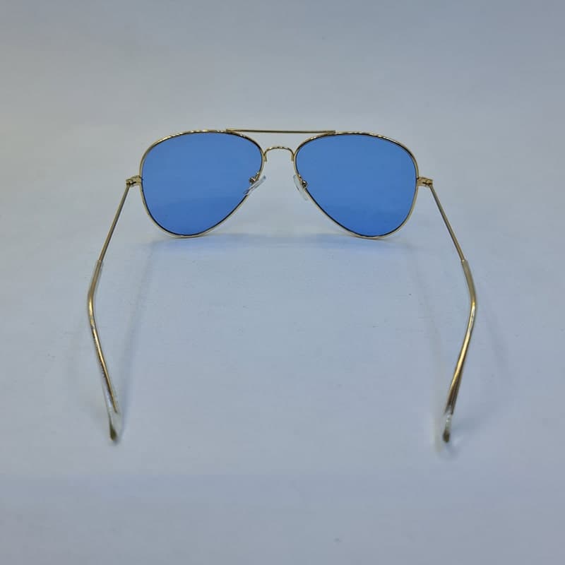عینک دید در شب با لنز آبی رنگ و فریم طلایی خلبانی Ray-Ban مدل 3026 — تصویر ۶