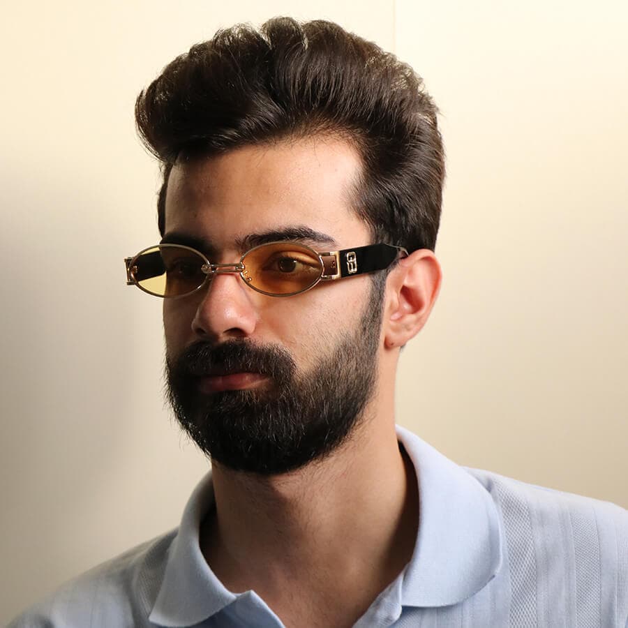 عینک شب جنتل مانستر با فریم طلایی، بیضی شکل و دسته مشکی و لنز قرمز مدل B2069 — تصویر ۲