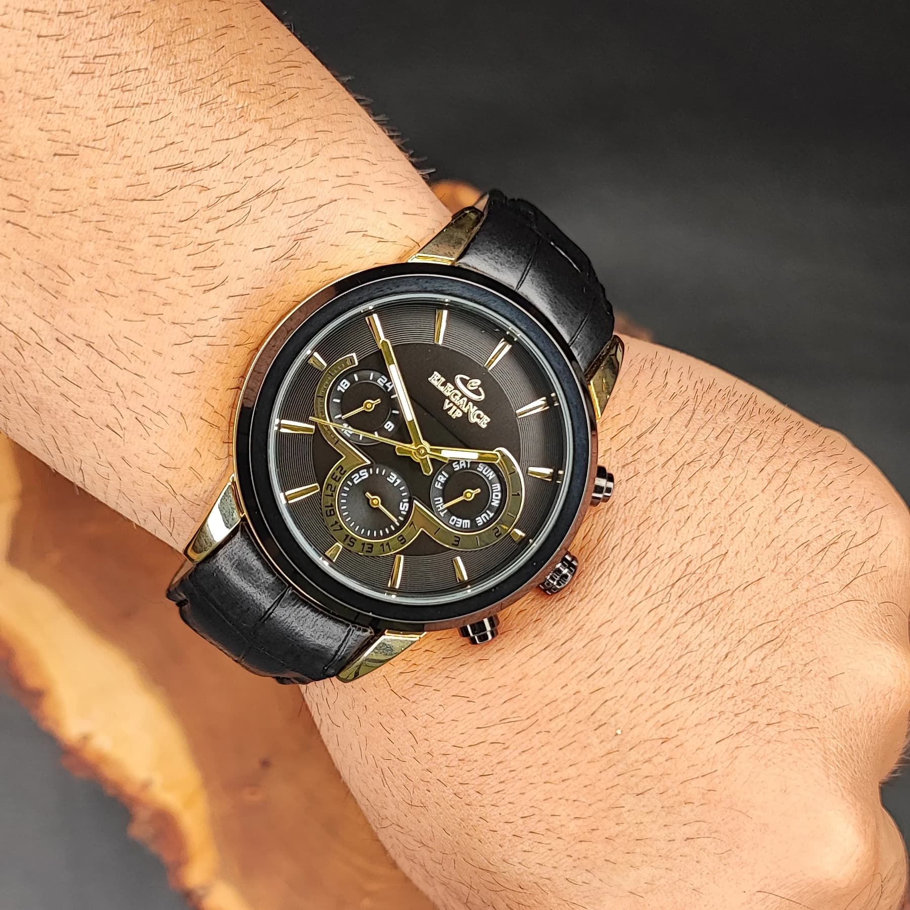 ساعت مچی عقربه ای مردانه الگانس مشکی طلایی مدل 1186G