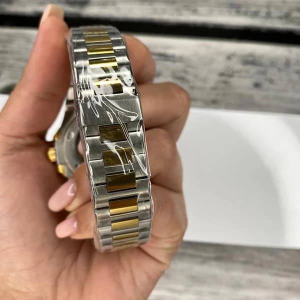 ساعت مچی مردانه پتک فیلیپ موتور ژاپن مدل ناتیلوس نقره ای طلایی سورمه ای (Patek Philippe Nautilus) — تصویر ۶