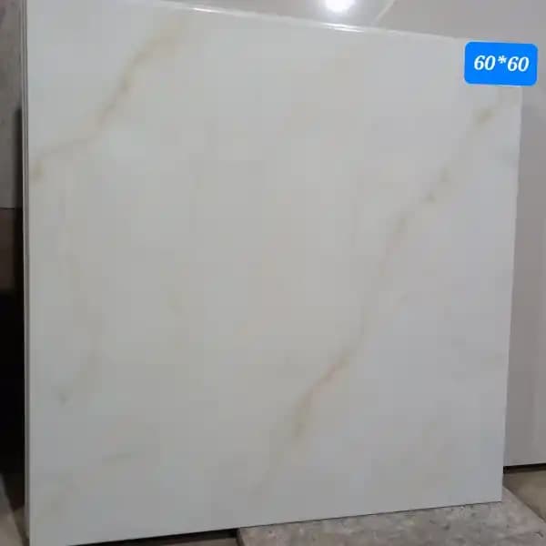 کاشی و سرامیک کف 60در60 طرح کلکته طلایی برندOLGAZENTO