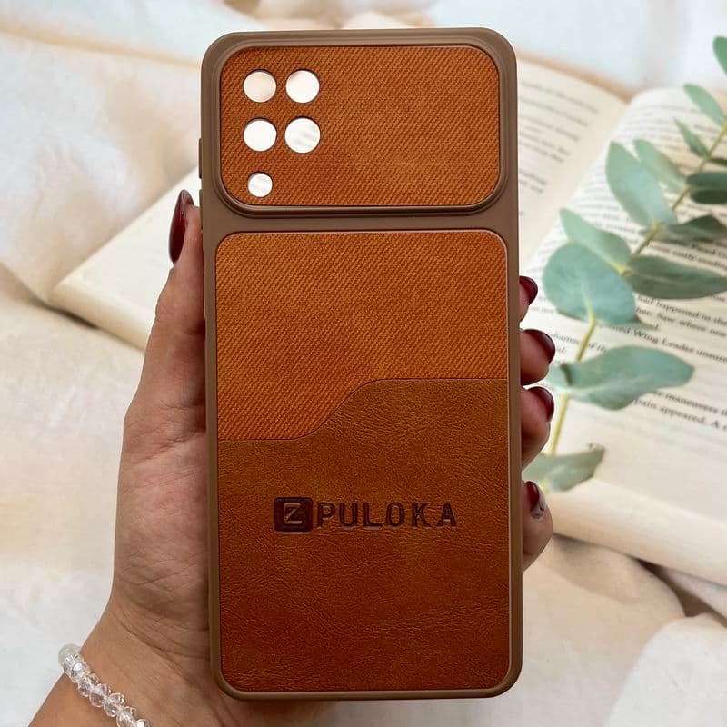 قاب گوشی Galaxy A12 / Galaxy M12 سامسونگ چرمی دو تکه PULOKA محافظ لنز دار عسلی کد 465543