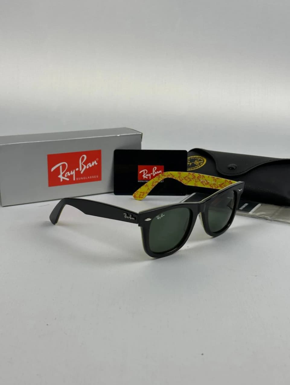 عینک مشکی زردrayban rb-2140