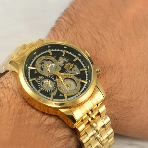 ساعت مچی عقربه ای مردانه اورینت مشکی طلایی مدل 9363G — تصویر ۵