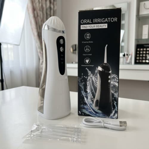 واترجت و دستگاه شستشوی دهان و دندان شارژی پرتابل مدل Oral Irrigator با ۴ سری نازل و ۳ حالت شستشو — تصویر ۶