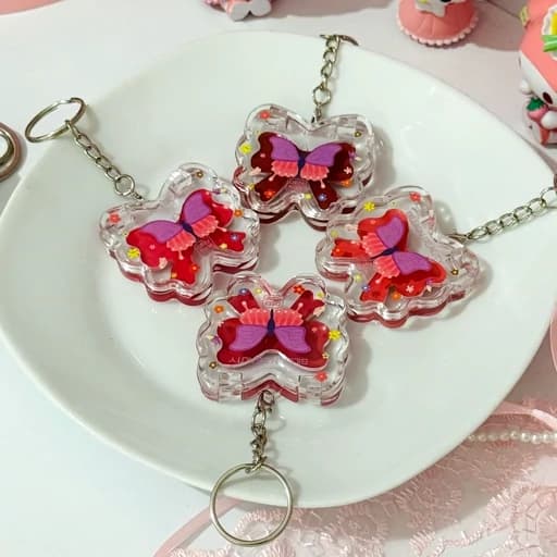 رژگونه و رژ لب سایه چشم صورتی گوگولی پروانه کیوت فانتزی پینترستی مناسب هدیه کادو دست کلید چارم بگ آویز کیف پرنسسی — تصویر ۲