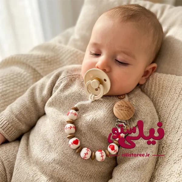 بند پستانک مهره ای سیلیکونی طرح حلقه ای برند ب ب میلا bebe mila — تصویر ۳