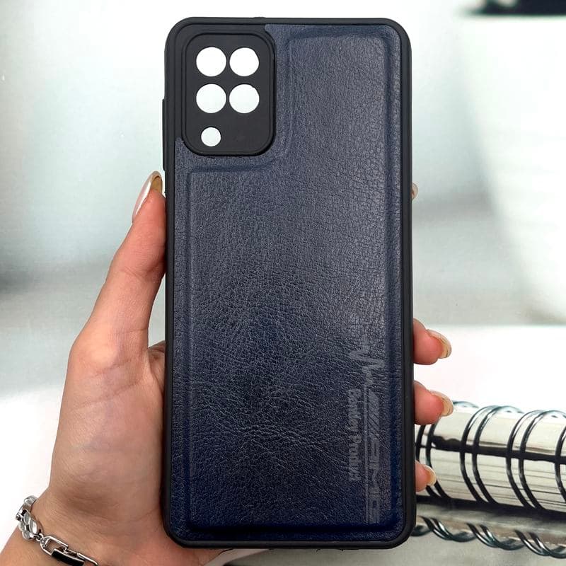 قاب گوشی Galaxy A12 / Galaxy M12 سامسونگ چرمی اورجینال کیس دور سیلیکونی AMG کلاسیک محافظ لنز دار سرمه ای کد 702571