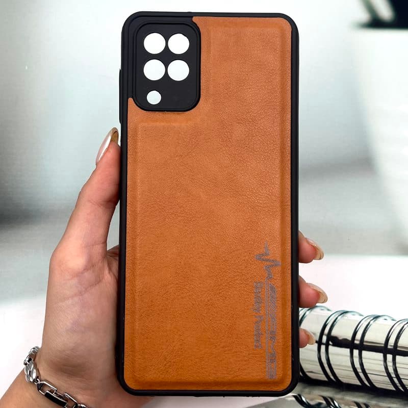 قاب گوشی Galaxy A12 / Galaxy M12 سامسونگ چرمی اورجینال کیس دور سیلیکونی AMG کلاسیک محافظ لنز دار عسلی کد 385084