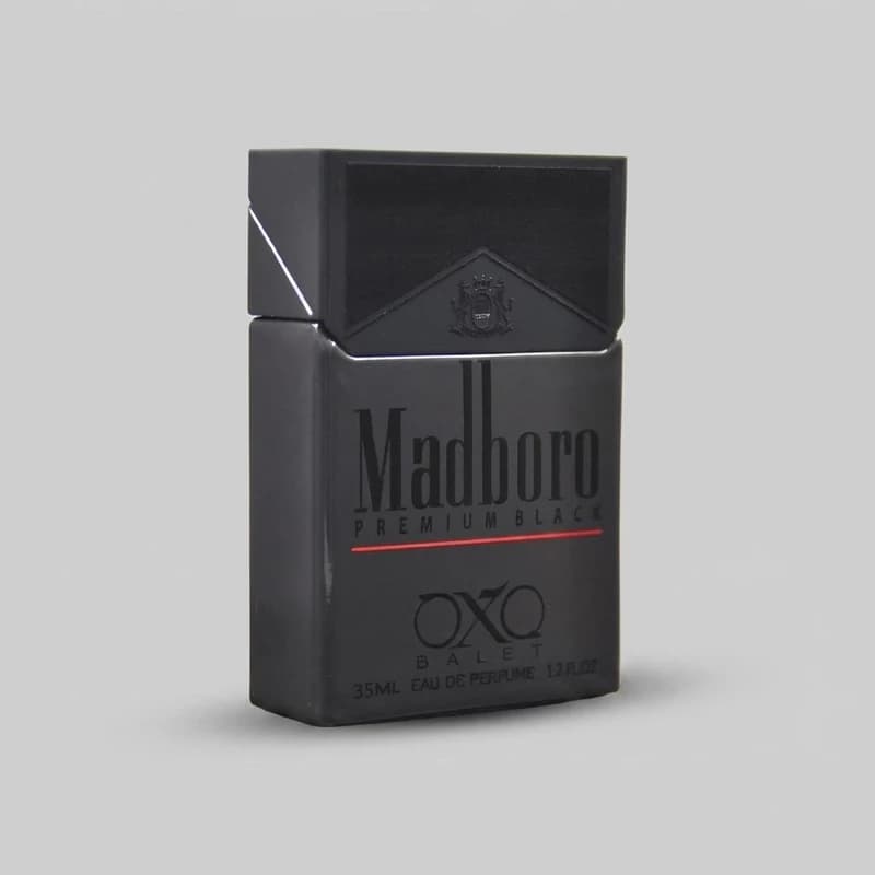 عطر جیبی اکس بالت مدل madboro premium black با رایحه گرم حجم 35 میل