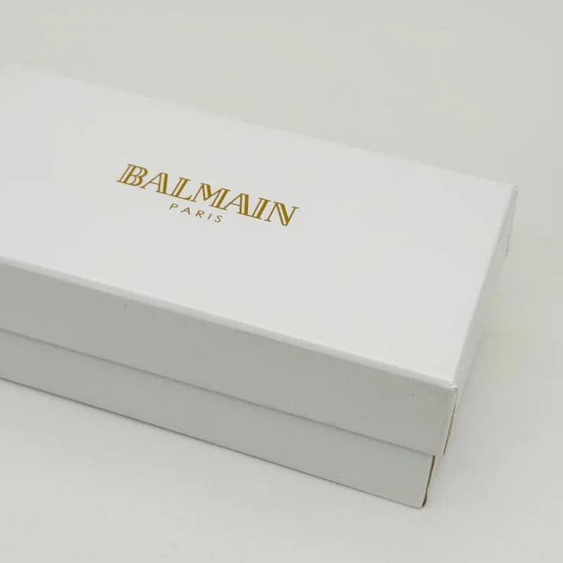 پک و جعبه عینک اورجینال بالمین Balmain پاریس هارد چرم مشکی طلایی — تصویر ۳