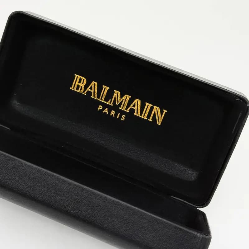 پک و جعبه عینک اورجینال بالمین Balmain پاریس هارد چرم مشکی طلایی — تصویر ۵