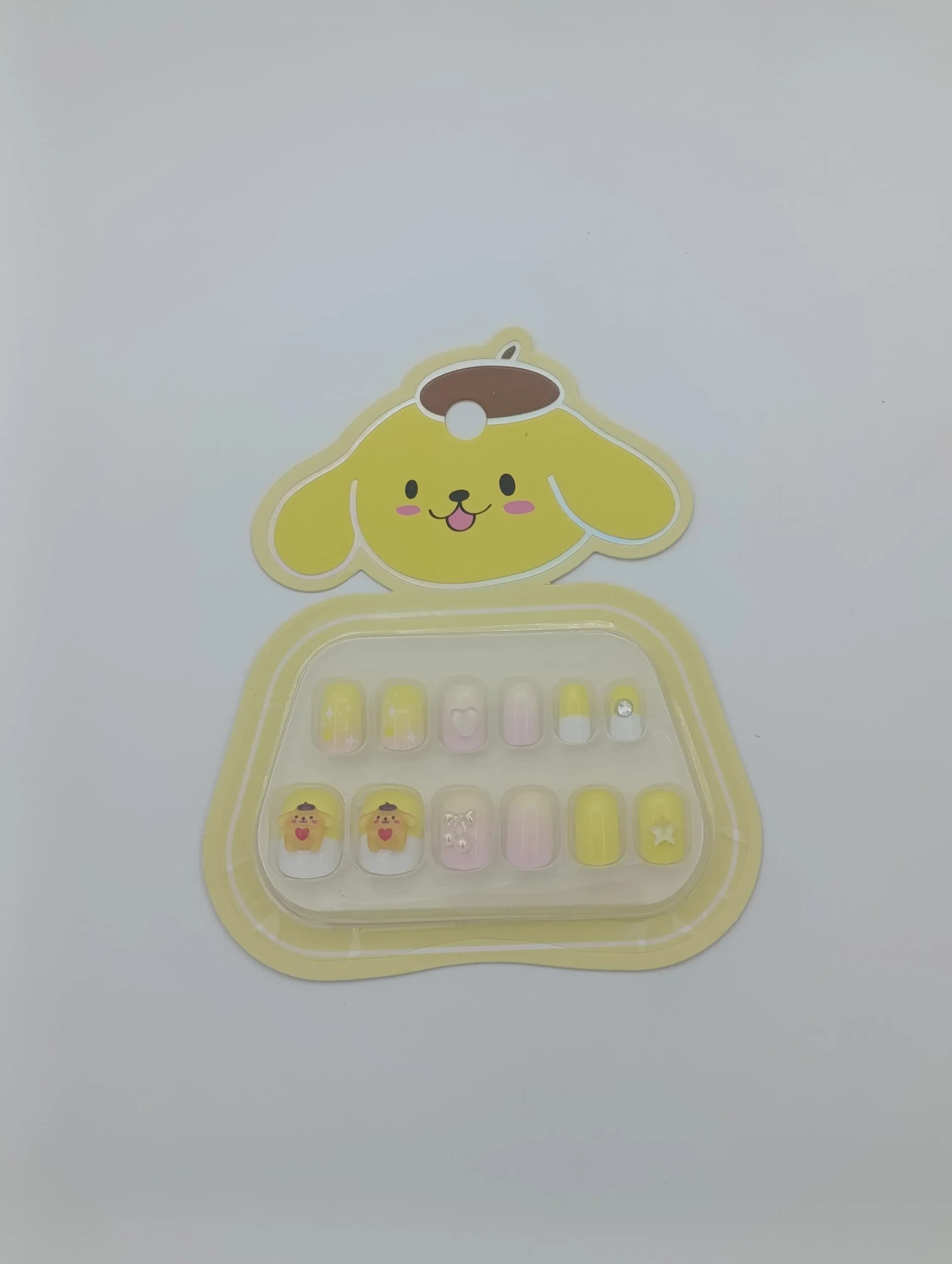 ناخن مصنوعی بچگانه طرح پومپوم پورین (پولو) Sanrio Pompompurin بسته ۱۲ عددی | زرد پاستلی، صورت برجسته ۳ بعدی، ستاره شاین و نگین‌دار