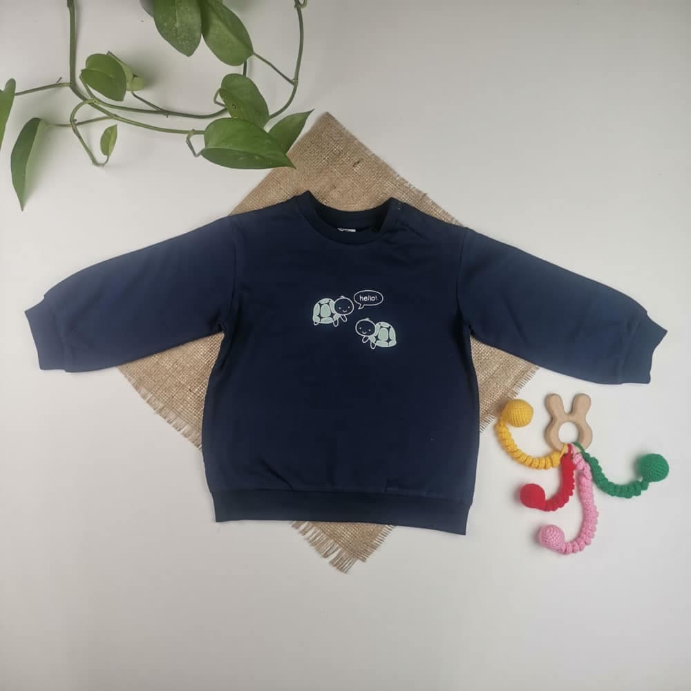 بلوز دورس نوزادی آستین بلند برند h&m طرح لاکپشت توکرکی سورمه ای رنگ – 12-18 ماه