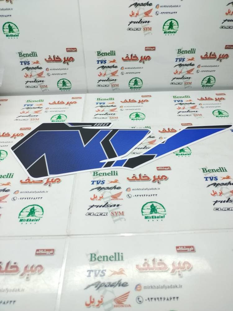 ارم (برچسب) قاب (فلاپ) درب بغل موتور sym گالکسی na ابی اصلی (چپ)