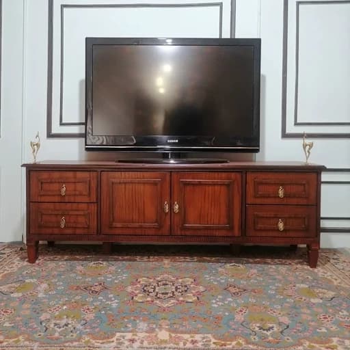 میز تلویزیون نئوکلاسیک کشودار ام دی اف سایز 160 فندقی کامنا مدل 13152850