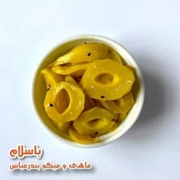 ترشی انبه سبز درجه 1 طعم ملس ظرف 1 کیلویی — تصویر ۳