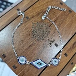 دستبند نقره زنانه چشم نظر لوزی آبکاری طلا سفید عیار 925 — تصویر ۳