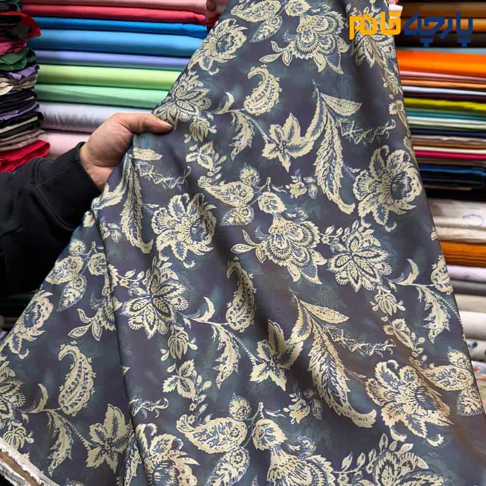پارچه بهاره تابستانه سیلک نخ طرحدار زمینه رنگ سرمه ای طرح کرم داماس کد9919