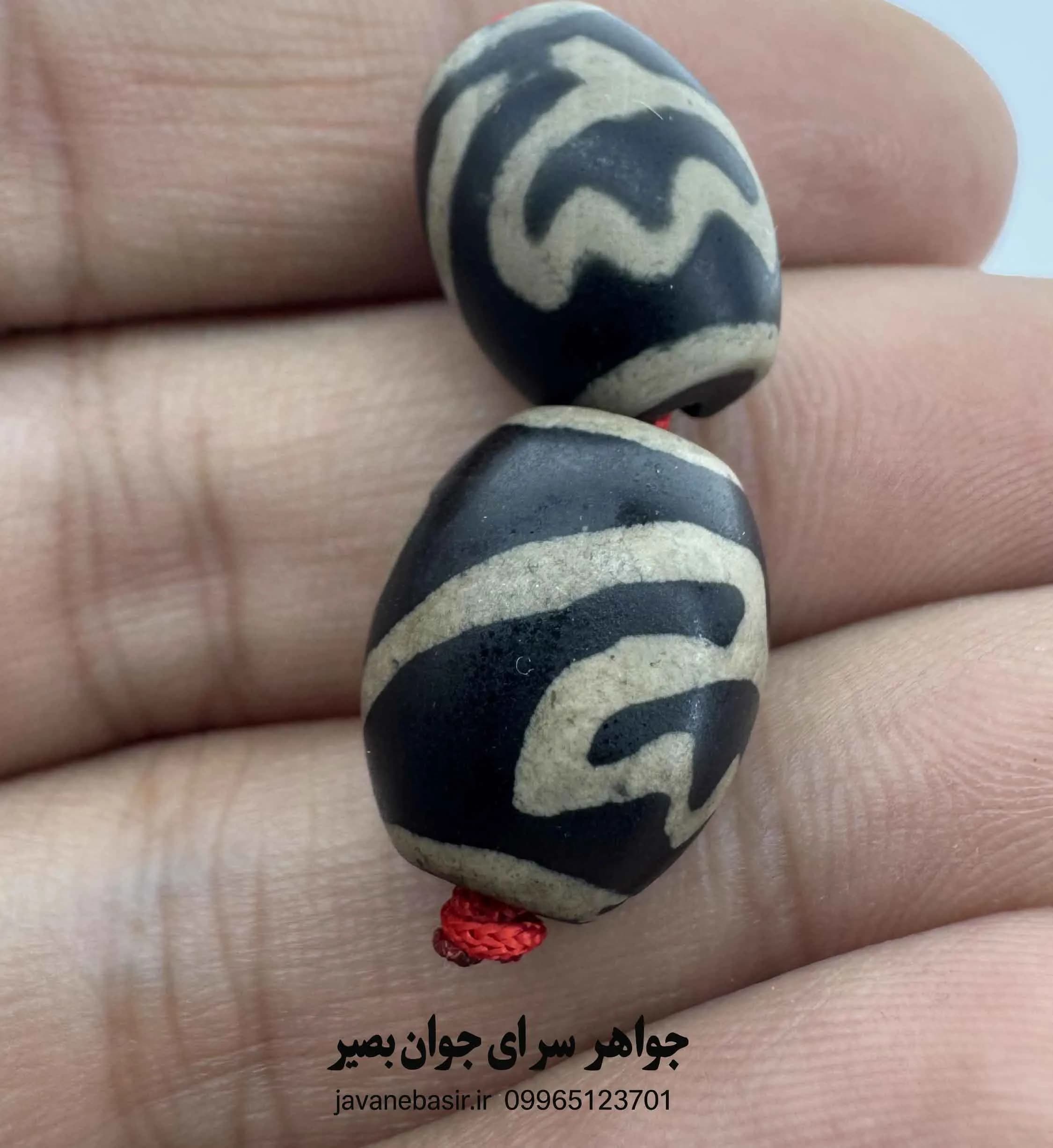جفت مهره بودایی با نقش چشمِ طبیعت؛ نماد بصیرت و مشاهده — تصویر ۲