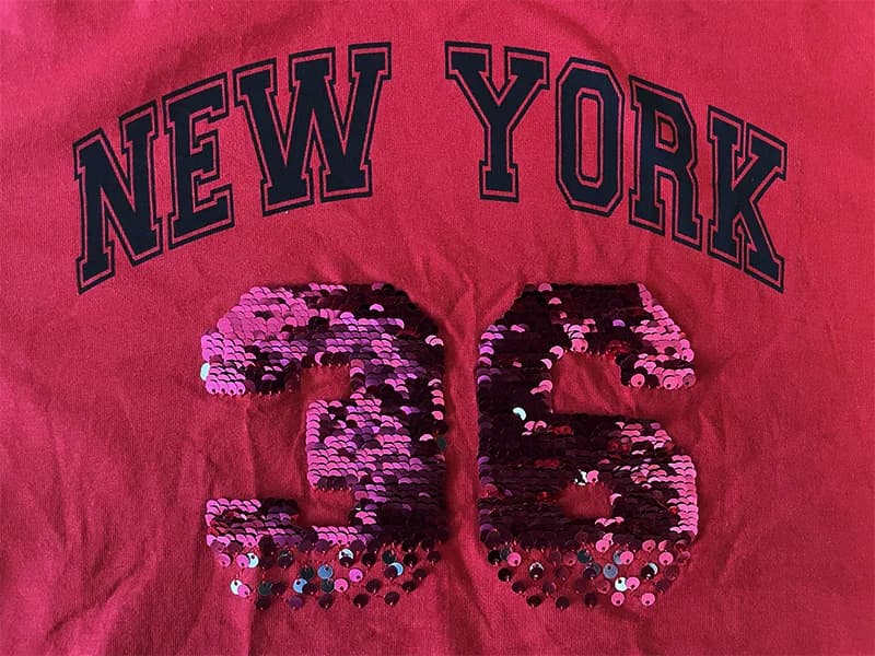 تیشرت کراپ آستین بلند نخی برند Juniors قرمز پولک برگردان new york 36 — تصویر ۶