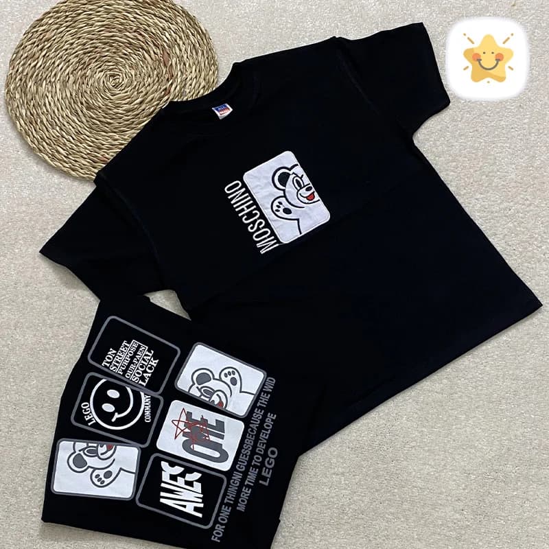 تیشرت مشکی دخترانه پنبه طرح MOSCHINO مناسب 9 تا 13 سال