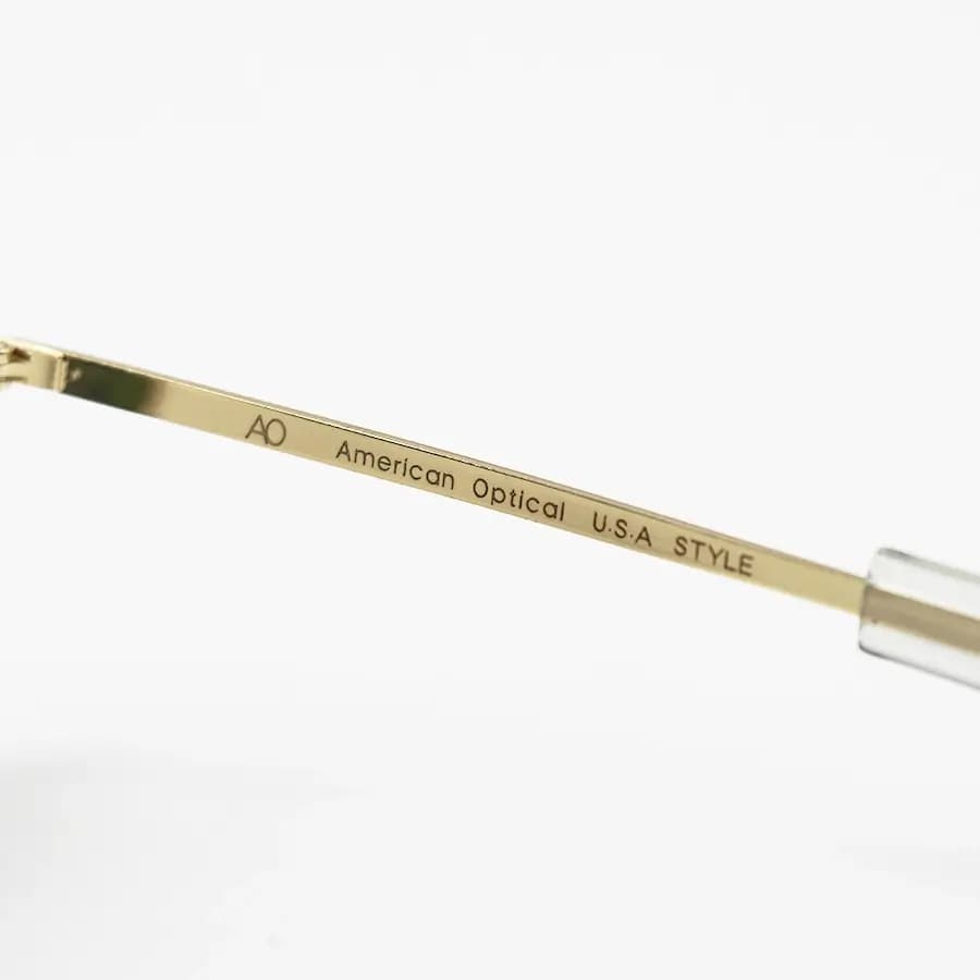 عینک آفتابی American Optical با فریم خلبانی، رنگ طلایی براق، عدسی جنس سنگ (شیشه) و سبز تیره مدل AO-1004 — تصویر ۸