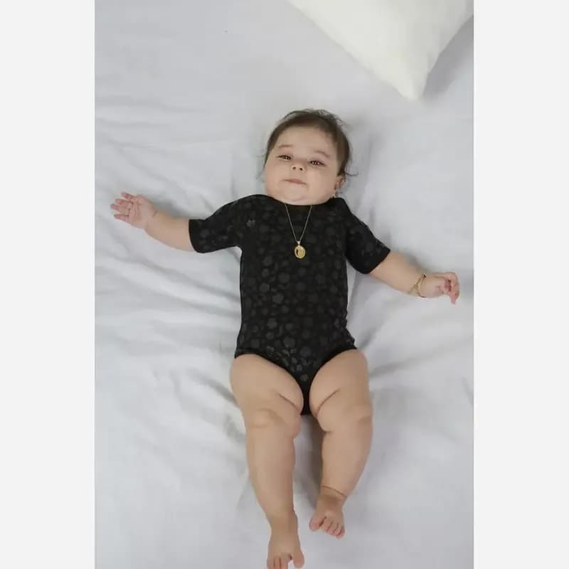بادی نوزادی زیر دکمه دار مشکی تمام نخ پنبه طرح دار — تصویر ۹
