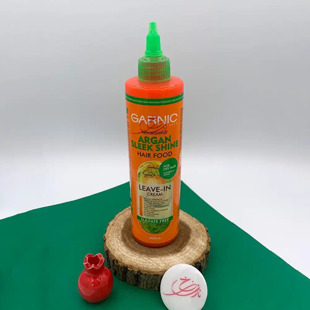 کرم موی بدون آبکشی گارنیک GARNIC مدل Argan Sleek Shine محافظ حرارت و تغذیه کننده موهای خشک حجم 300 میلی لیتر