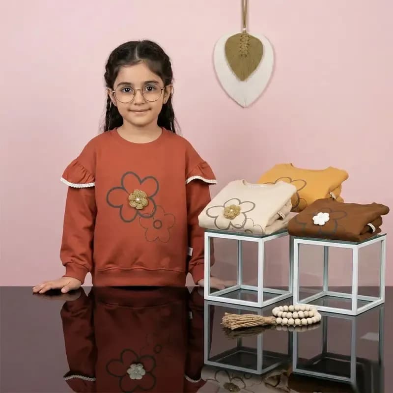 بلوز دخترانه طرح گل بالکدار رنگ نسکافه ای جنس پنبه — تصویر ۹