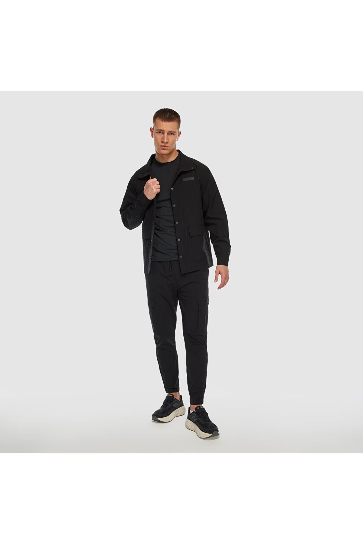 شلوار گرمکن ورزشی نیو بالانس مردانه مشکی راسته Regular/رگولار فاق نرمال Relaxed/ریلکس اسپرت | New Balance APP422 TR — تصویر ۶