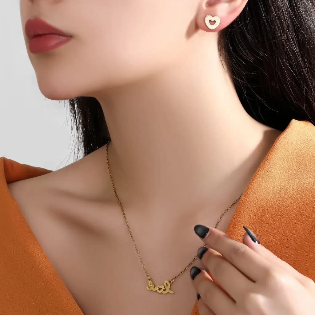 نیم ست گردنبند و گوشواره زنانه مدل love قلب رنگ طلایی جنس استیل ضد حساسیت رنگ ثابت کد zmp