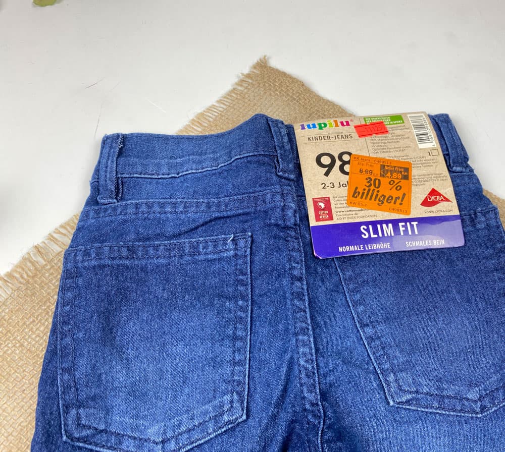 شلوار جین slim fit برند lupilu طرح جیب دار دکمه قزن دار سورمه ای رنگ — تصویر ۶