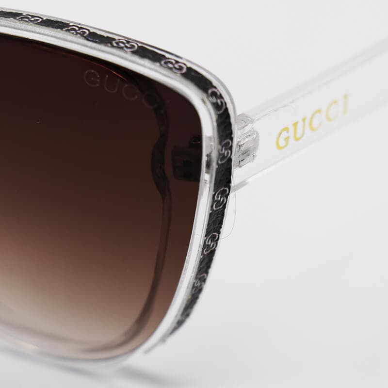 عینک آفتابی زنانه GUCCI با فریم شفاف و بی رنگ، گربه ای و لنز قهوه ای مدل 7257 — تصویر ۵