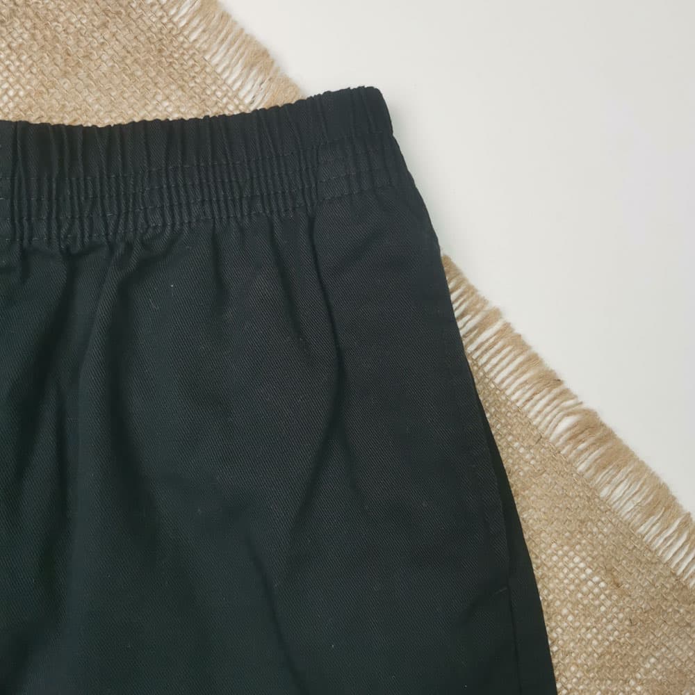 شلوارک برند Tu طرح جیب دار مشکی رنگ – 7 سال — تصویر ۳