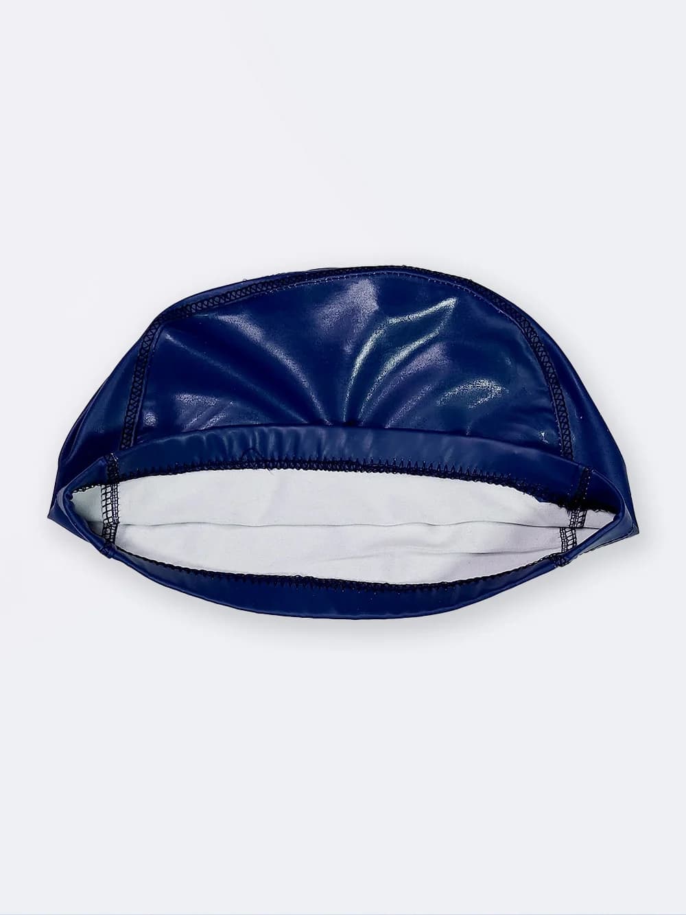 کلاه شنا زنانه و مردانه به رنگ آبی نفتی اسپیدو ( Speedo ) با جنس فومی ضد کلر — تصویر ۳