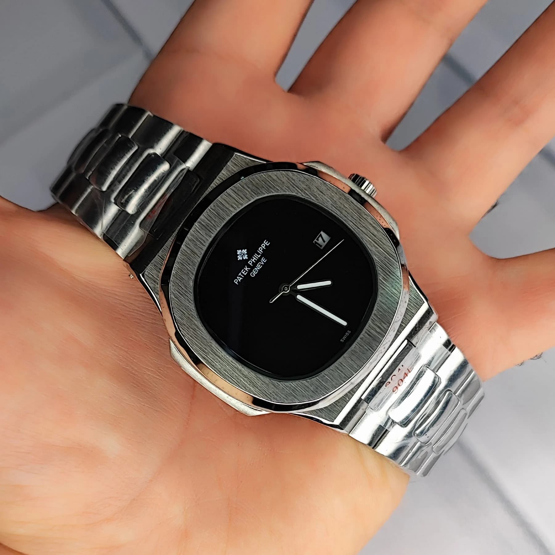 ساعت مچی مردانه پتک فیلیپ موتور ژاپن مدل ناتیلوس نقره ای مشکی (Patek Philippe Nautilus) — تصویر ۳