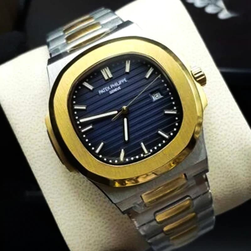ساعت مچی مردانه پتک فیلیپ موتور ژاپن مدل ناتیلوس نقره ای طلایی سورمه ای (Patek Philippe Nautilus) — تصویر ۲