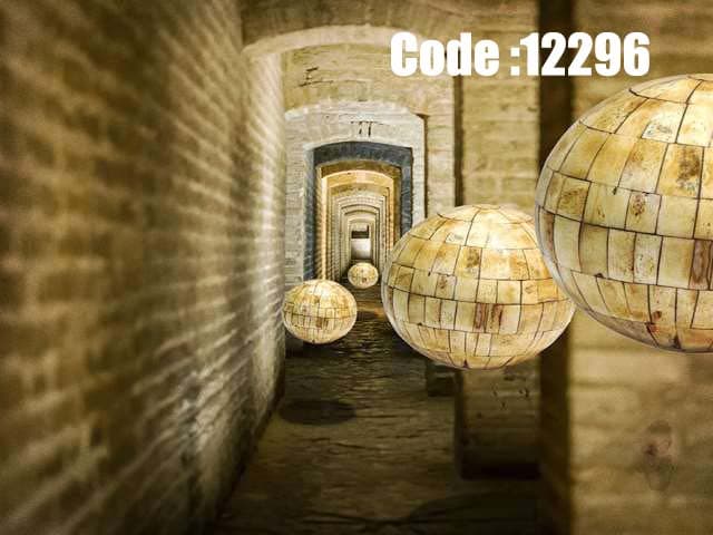 پوستر دیواری طرح گویهای طلایی در راهروی سنگی