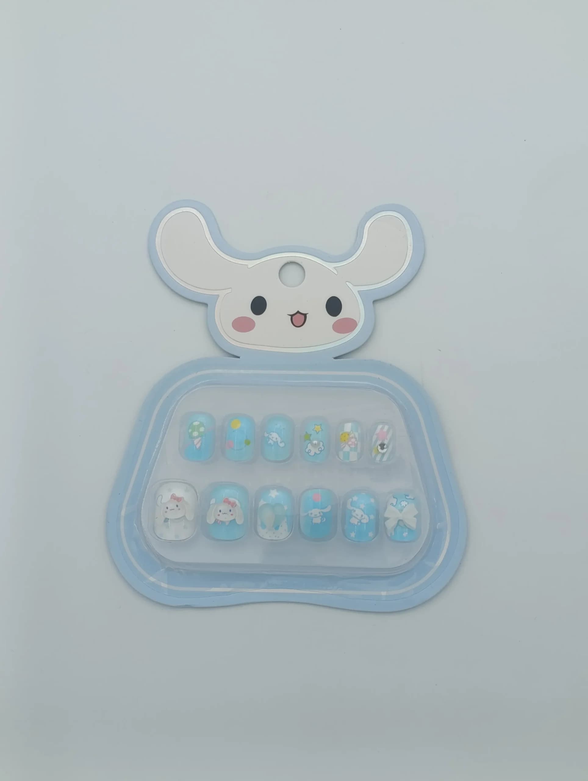 ناخن مصنوعی بچگانه طرح سینامورول Sanrio Cinnamoroll بسته ۱۲ عددی | دارای چسب ژلهای ضد حساسیت، پاپیون ۳ بعدی برجسته و نگیندار