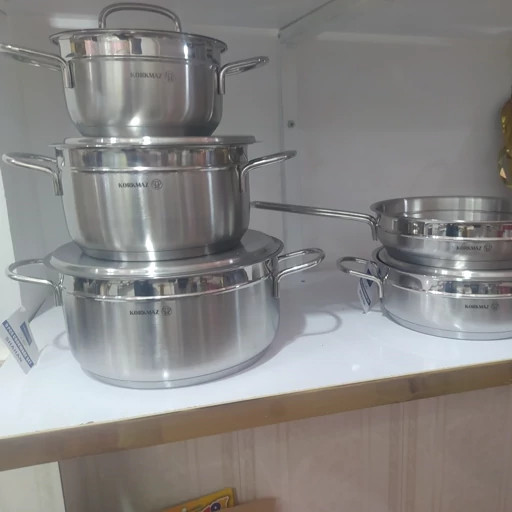 سرویس قابلمه 9پارچه استیل کرکماز (ساخت ترکیه )حک شدن کف چدن