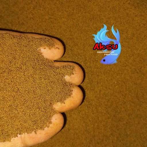 غذای ماهی 0.5 میل گوپی بیومار سومو محرک رشد و رنگ و باله 250 گرمی