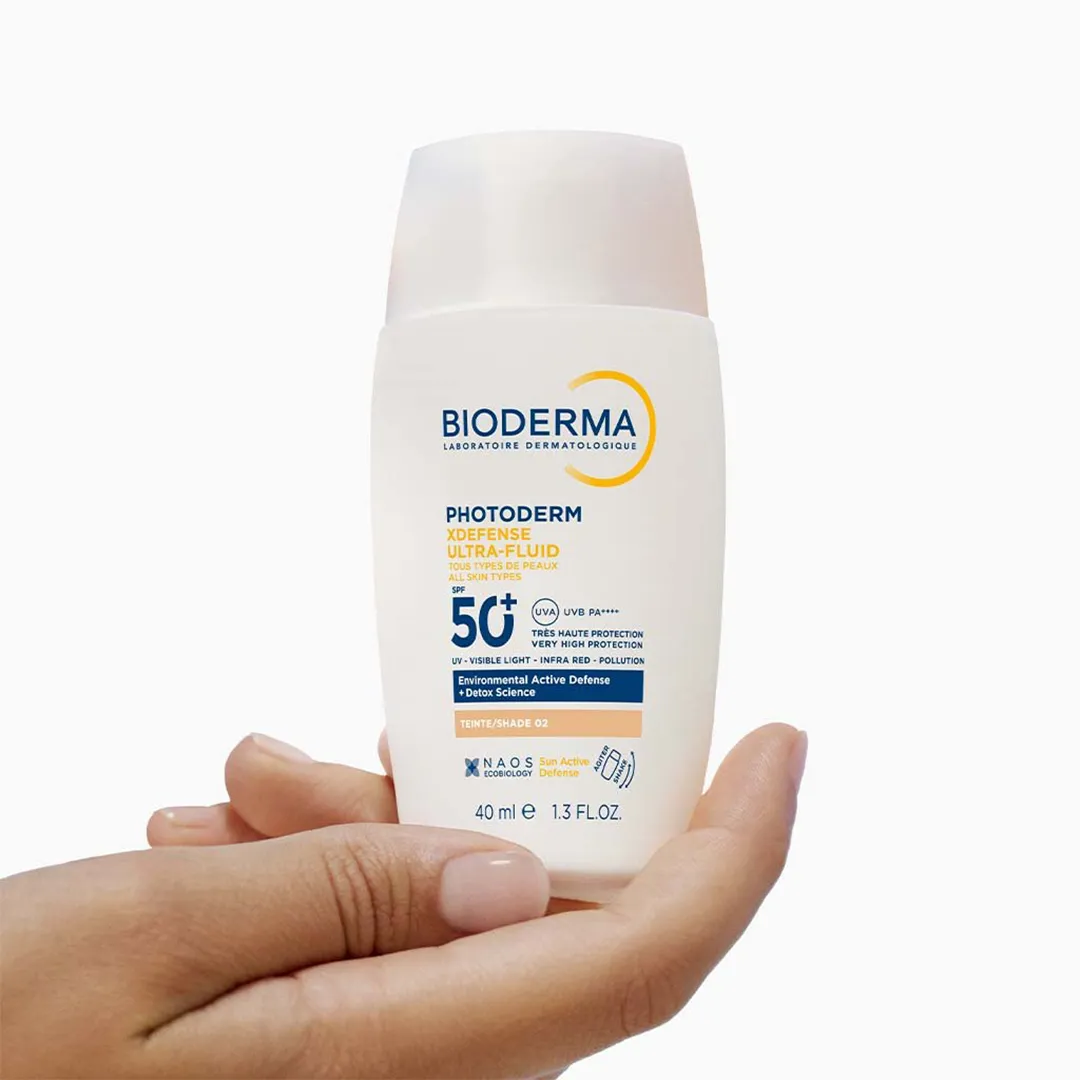 کرم ضد آفتاب رنگی فلوئیدی بایودرما PHOTODERM XDEFENSE ULTRA-FLUID SPF50 شماره 02 حجم 40 میلی لیتری — تصویر ۴