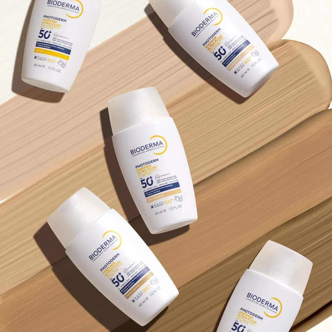 کرم ضد آفتاب رنگی فلوئیدی بایودرما PHOTODERM XDEFENSE ULTRA-FLUID SPF50 شماره 02 حجم 40 میلی لیتری — تصویر ۵